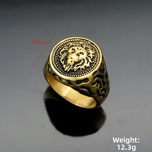 Detailed macro view of the 19mm gold lion head signet ring showing weight 12.3g