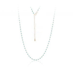 Close-up of S925 sterling silver tag and turquoise beads on a gold-plated chain