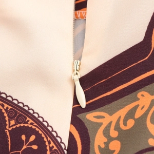 Women's beach vacation set featuring a vintage print blouse and hidden zipper detail