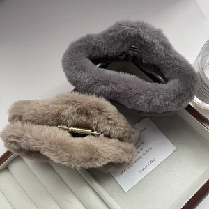 Plush cloud-shaped hair claw clips in grey and khaki faux fur with gold metal spring