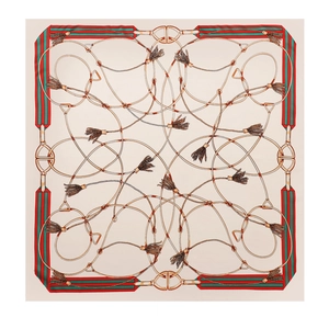 Close-up of 90cm square silk scarf featuring vintage equestrian horsebit print details