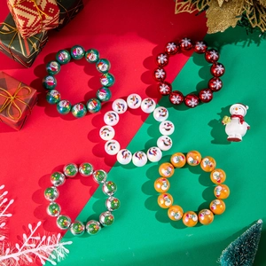 Detail of five colorful Christmas beaded bracelets featuring snowman and Santa prints