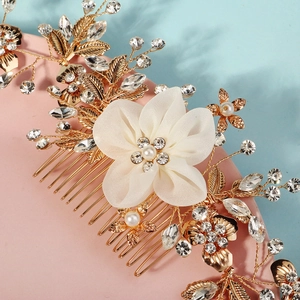 Golden bridal hair comb with elegant white fabric flowers, pearls and crystals
