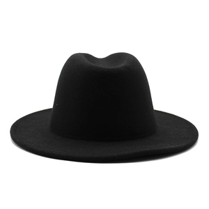 Detail of classic wide brim fedora hat with thick wool felt texture and flat brim