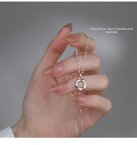 Detail of S925 sterling silver Mobius ring pendant necklace with thin chain