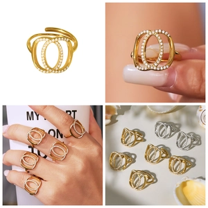 Detail view of double-layer oval rings with micro-pave cubic zirconia in gold and silver