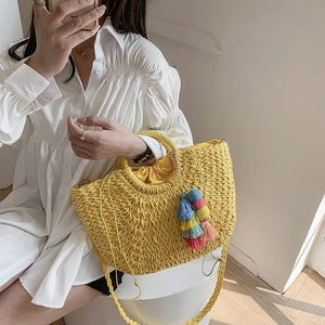 Bohemian yellow woven straw handbag with colorful tassels and crossbody shoulder strap