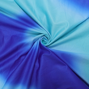 Detail showing the smooth gradient fabric texture with blue to green color transition