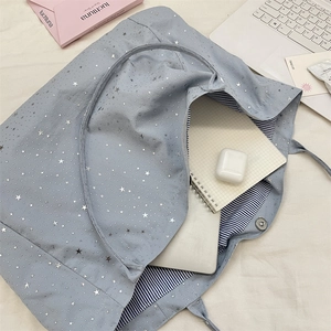 Spacious star print tote bag interior showing capacity for laptop and daily essentials