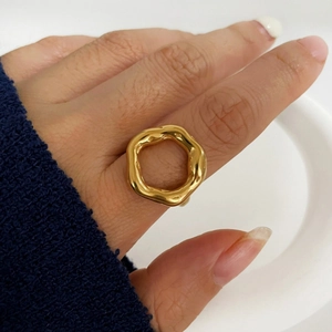Fashionable gold hexagonal irregular lava ring with high gloss texture on finger