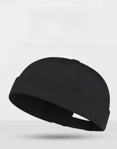 Detail of black quick-dry docker cap featuring six-panel construction and adjustable strap