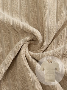 Detailed macro view of textured beige striped terry knit fabric for men's short sleeve shirt