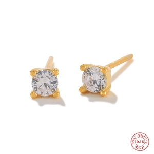 Macro view of 925 sterling silver stud earrings with round clear zircon in four-prong setting