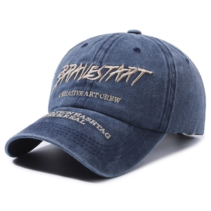 Vintage navy washed denim baseball cap with brown letter embroidery on front and brim