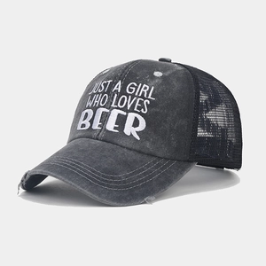 Detailed view of the distressed grey trucker hat with JUST A GIRL WHO LOVES BEER embroidery