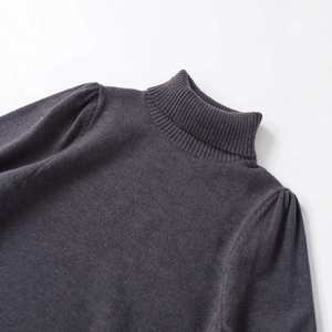 Dark grey slim fit knit top with high neck and subtle puff sleeves for autumn and winter