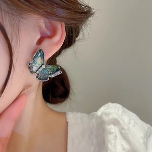 Elegant blue and green gradient butterfly stud earrings with gold leaf and resin details