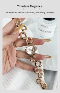Detail of GEDI rose gold quartz watch featuring a square dial and unique hollow link bracelet