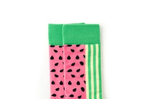 Close-up of knitted crew socks featuring vibrant pink watermelon slices and green stripes