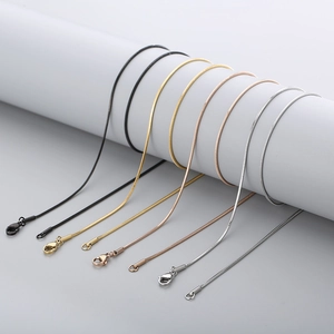 Polished stainless steel snake chain necklaces in black, gold, and silver finishes