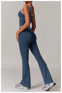 Detail of high-waist yoga set with grey-blue contrast piping and push-up fit