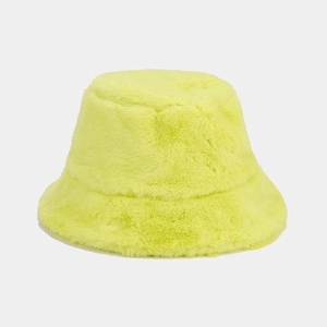Detail of neon green plush bucket hat with soft faux fur texture for winter fashion