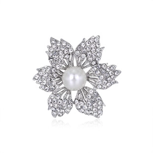 Detailed close-up of a silver flower brooch featuring clear rhinestones and a pearl center