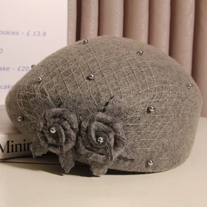 Detail of wool beret with grey mesh veil, hand-crafted fabric roses and faux pearls