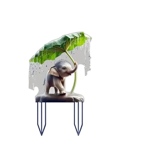 Cute baby elephant sheltered under a leaf garden stake for potted plant decoration