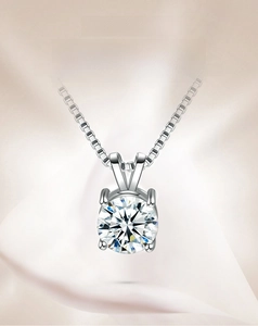 Macro shot of S925 silver necklace with 1 carat round zircon in a four-prong V-setting