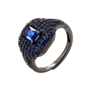 Macro shot of S925 silver stamp and blue crystal pavé on adjustable hip hop square ring