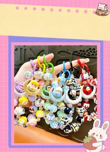 Colorful hand-painted bead phone charms with cute moon doll character pendants