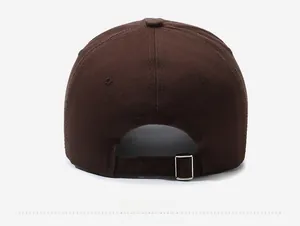 Detail view of the back of a washed cotton baseball cap with adjustable metal buckle
