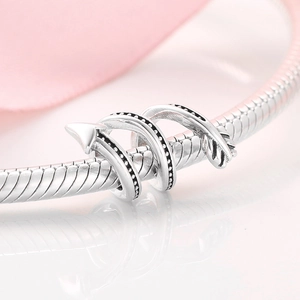 S925 sterling silver arrow wrap charm with black oxidation on snake chain bracelet