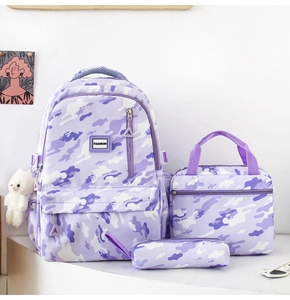 Three-piece purple camo backpack set including school bag, lunch bag, and pencil case