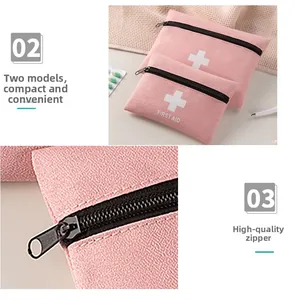 Detail of pink first aid kit zipper and two sizes of portable medicine storage bags