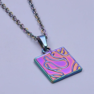 Macro shot of square rainbow titanium pendant with fluid 18k plated textures