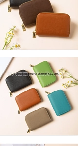 Detail of RFID leather card wallets with lychee pattern and smooth gold zippers