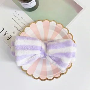 Soft plush purple striped spa headband with cute oversized bow for washing face