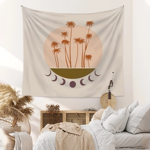 Detail of bohemian wall tapestry with palm tree and moon phases in a cozy bedroom