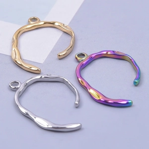 Irregular textured hoop pendants in gold, silver, and iridescent steel for DIY jewelry