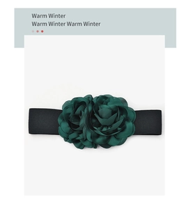 Detail of dark green satin flower petals on a black elastic waist belt for dresses