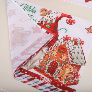 Christmas place mat featuring gingerbread men and trees with a focus on thick fabric texture