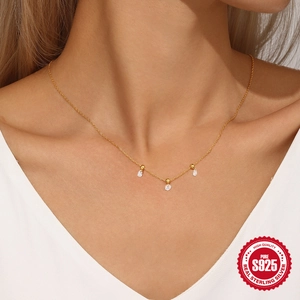 Elegant gold S925 sterling silver necklace with three zircon drops on female model