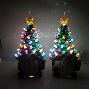Close-up of ceramic Christmas tree gnomes with colorful glowing LED lights and yellow star