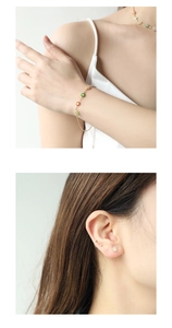 Detail shot of colorful enamel daisy bracelet and stud earrings set on a model