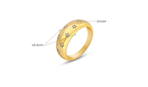 Detailed view of a 0.6cm wide 18K gold plated ring with star-set zircon stones
