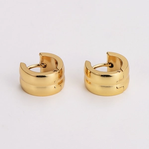 Polished gold stainless steel wide hoop earrings for men and women on white background