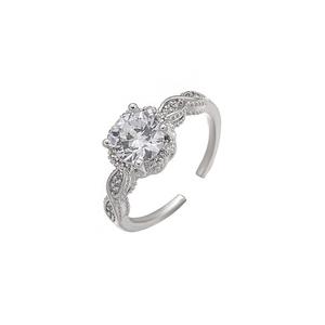Detail of adjustable silver ring with sparkling floral zircon and twisted pave band