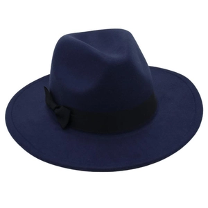 Detail of dark blue wool fedora hat featuring a black grosgrain ribbon and side bow